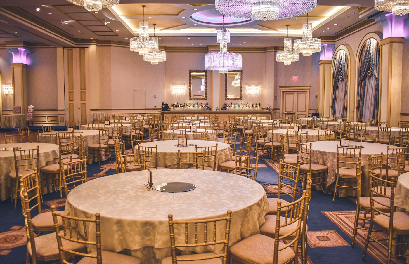 A banquet hall dressed in gold for a reception