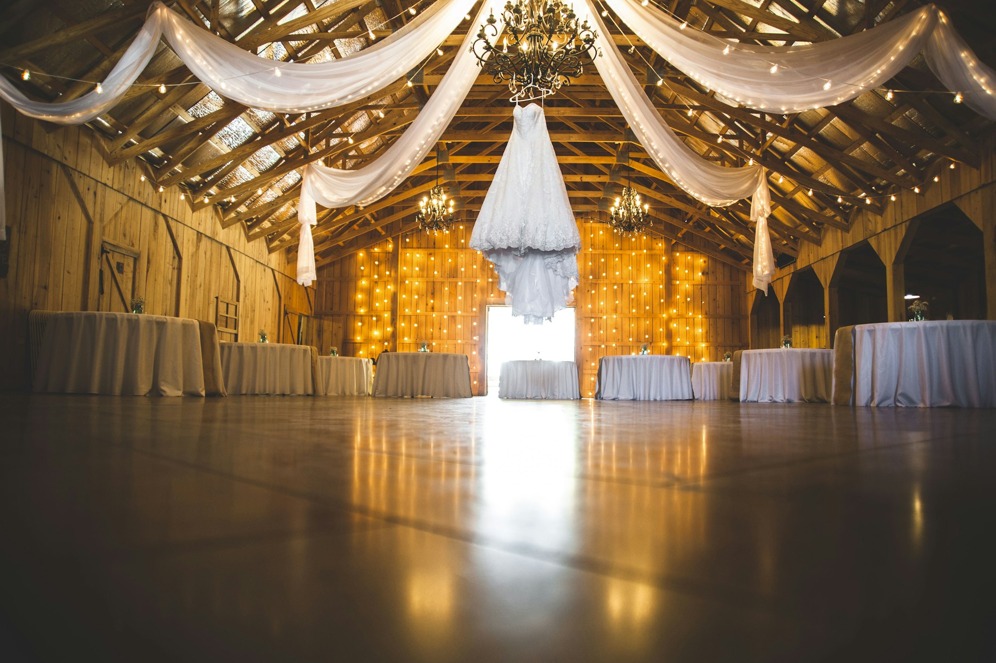 A chandelier-lit ballroom set for a gala